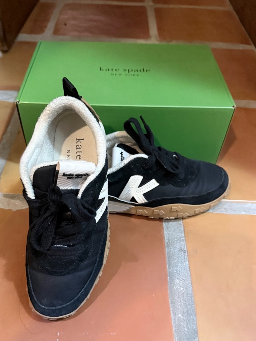 Kate Spade New York K As In Kate Runner sneakers in black. Style KM812.